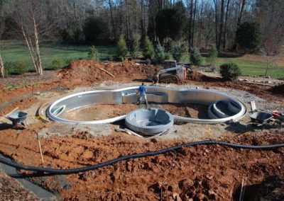 7. Pool is backfilled and aluminum coping or liner receptor is installed. Concrete decking is formed.